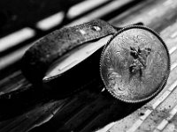 Derick Costa Jr.'s, 10, belt buckle is set asside as he prepares for his first ride at the final event in the New England Rodeo championship in Norton, MA.